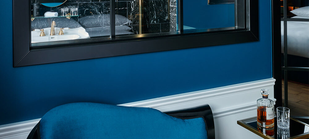 Intime Room: blue velvet couch with small table