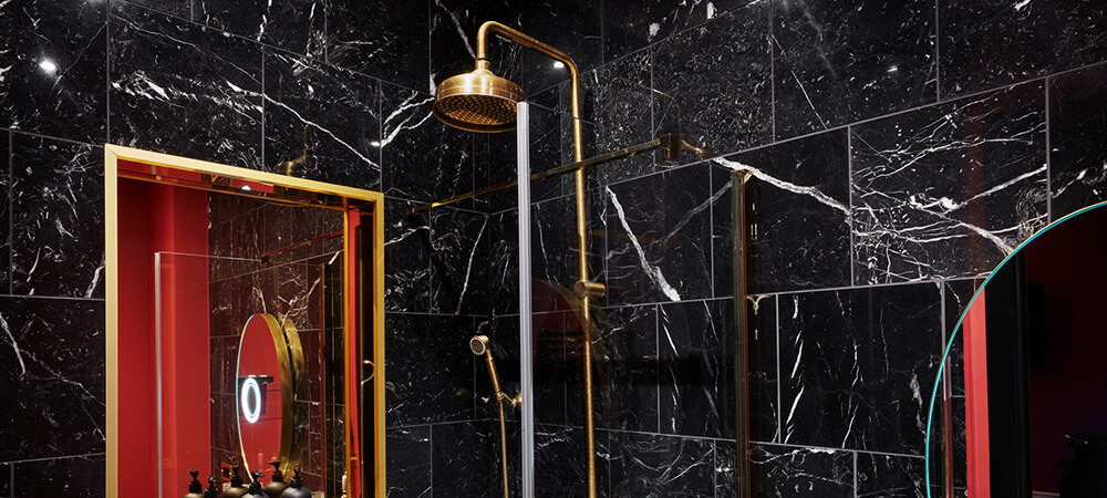 Terrace Suite: soft rain shower in a black marble bathroom